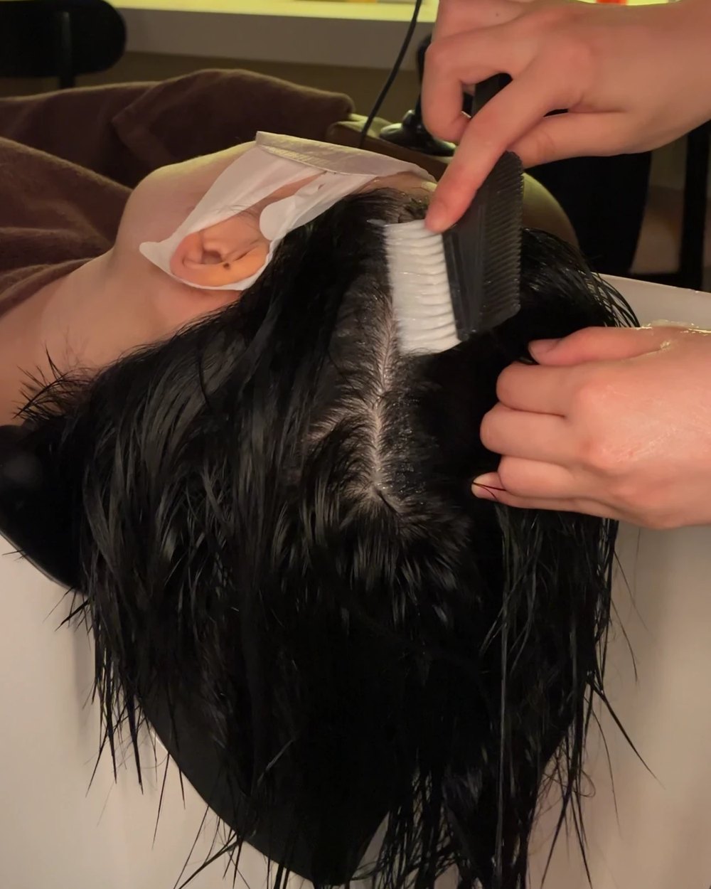 Cleansing at the head spa basin during Ultimate 120